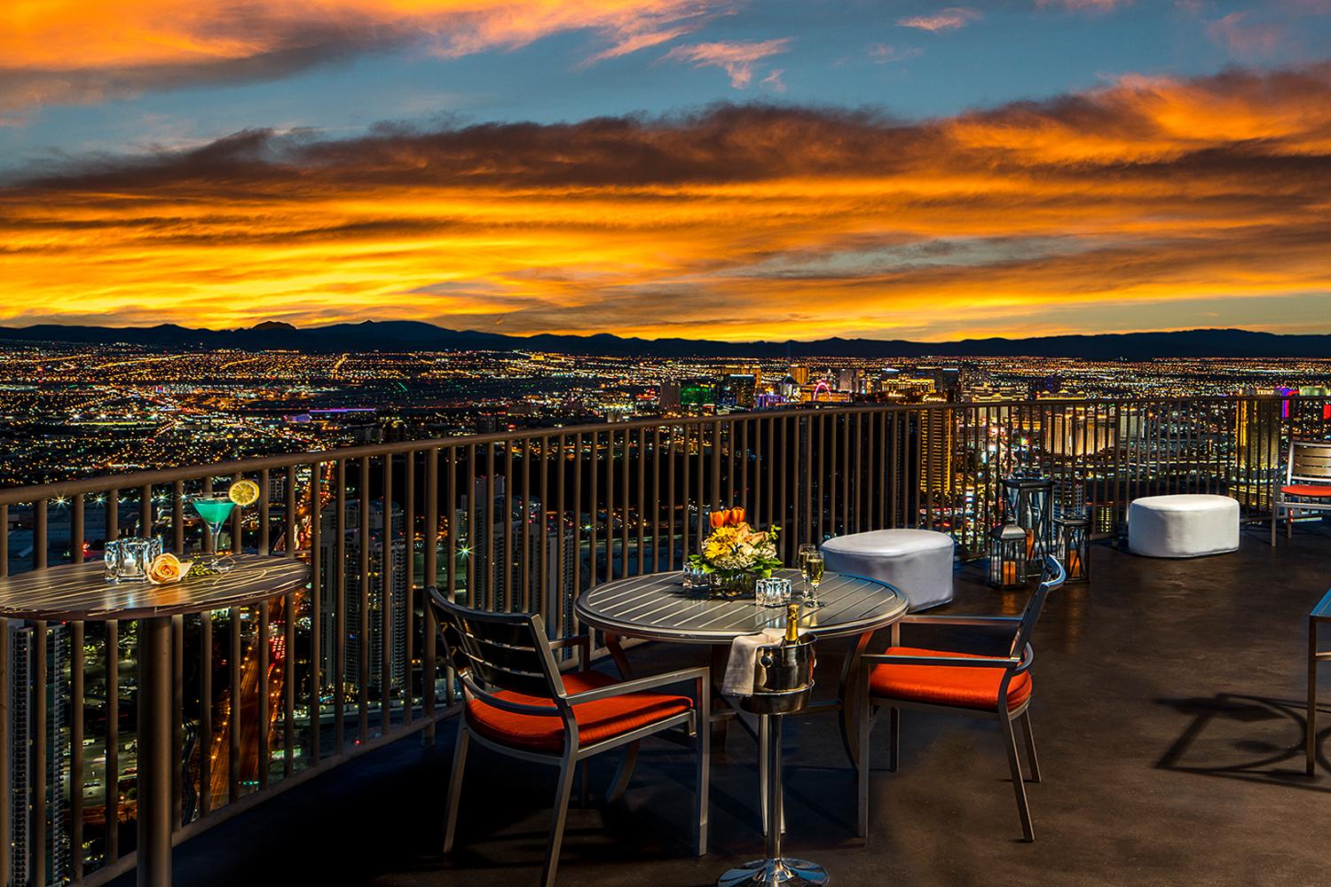 The STRAT Tower Level 112 Private Patio with tables chairs and champagne bucket
